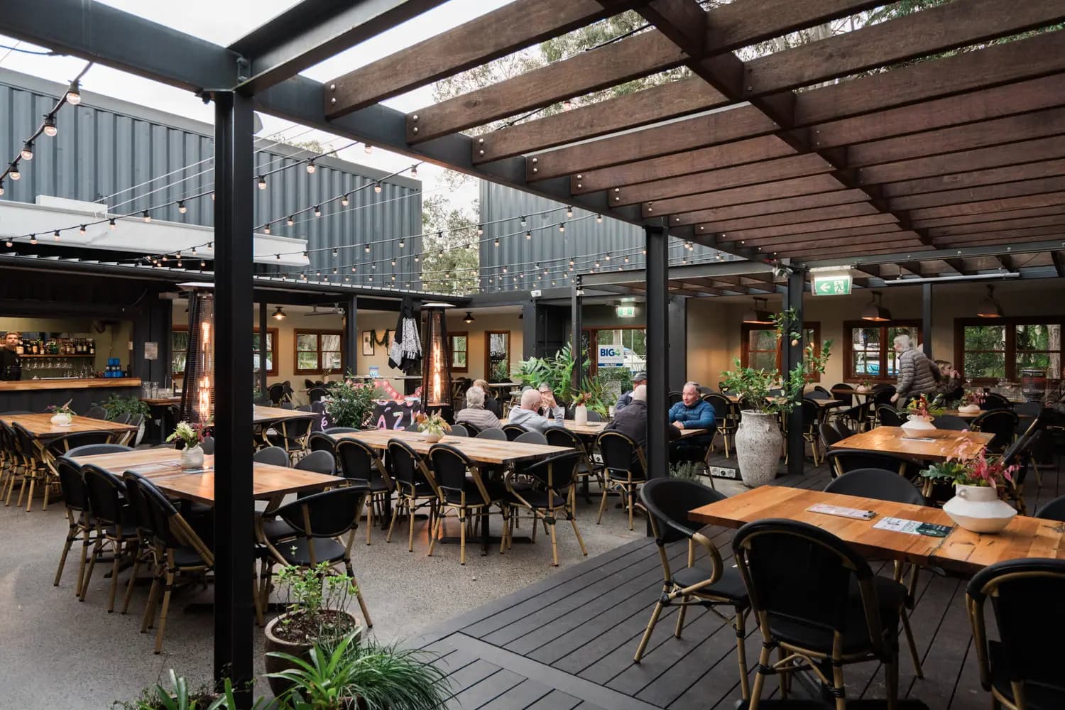 Long tables set for a celebration in The 383 courtyard
