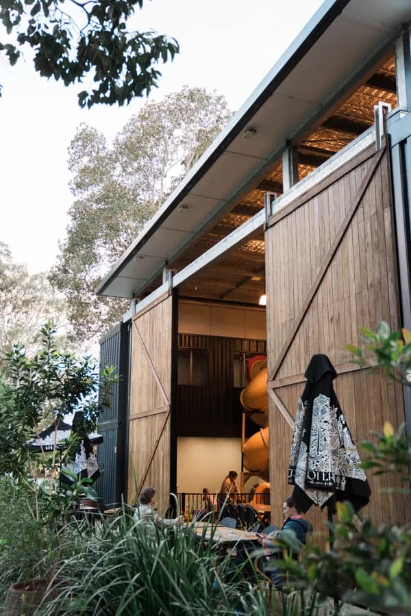 The Courtyard’s barn doors open onto the string-lit courtyard at The 383 Wooli